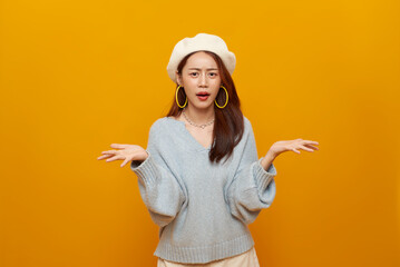 Confused decision making concept with Asian woman raising hands and questioning choice to express uncertainty problem solving hesitation modern lifestyle emotion.