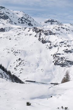 The Forcola di Livigno a high mountain pass on the Italy-Switzerland border connecting Livigno (IT) to the Bernina Pass (CH). The road open only in summer and closes annually in winter due to snow. 