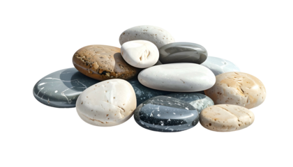 Smooth, rounded stones in varying colors are piled together against a stark black backdrop