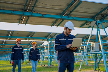 Engineers are working at solar farm.