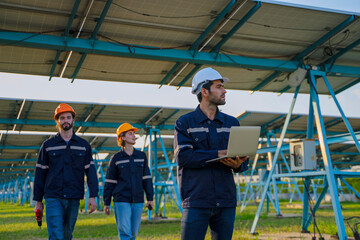 Engineers are working at solar farm.
