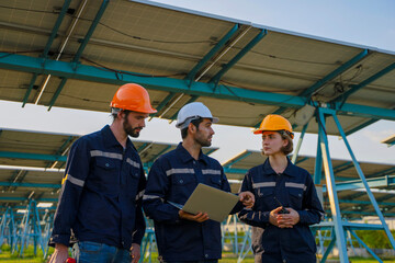 Engineers are working at solar farm.