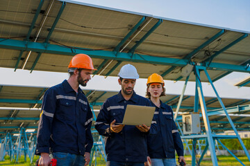 Engineers are working at solar farm.