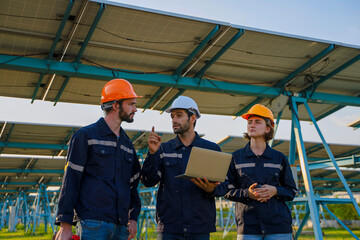 Engineers are working at solar farm.