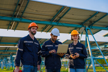 Engineers are working at solar farm.