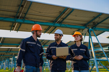 Engineers are working at solar farm.