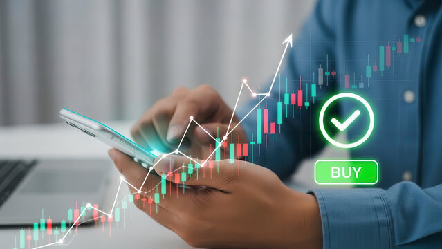 Close up of a person using a smartphone with a glowing digital interface showing a rising stock market candlestick chart and a green buy button with a checkmark for financial trading - Powered by Adobe