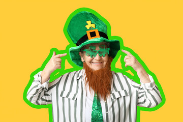 Senior woman in leprechaun hat and decorative glasses with red beard on yellow background. St. Patrick's Day celebration