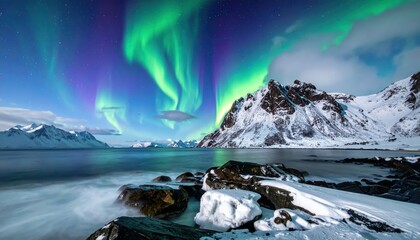 Spectacular aurora borealis illuminates frozen arctic coastline