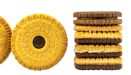 Close-up of yellow cookies with central chocolate filling, and a stacked sandwich cookie