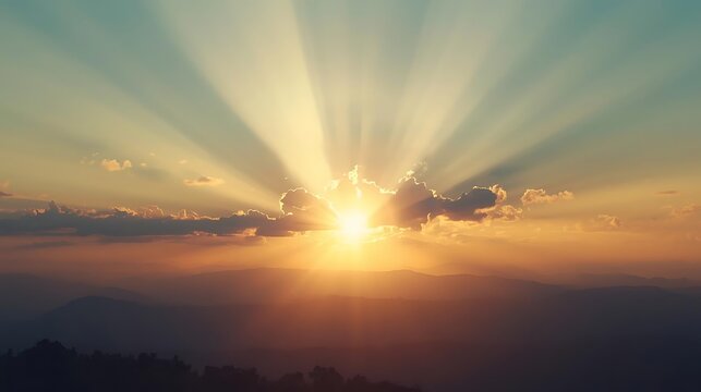 Beautiful sunrise over mountains with sun rays
