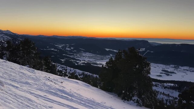 Sunset on the Vercors mountain range covered by snow ; panoramic view on the Vercors in winter from the top of the mountain