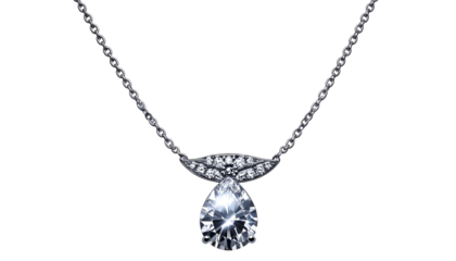 A close-up studio shot presents an elegant necklace with a pear-shaped diamond pendant. The silver chain hangs delicately. The pendant captures light