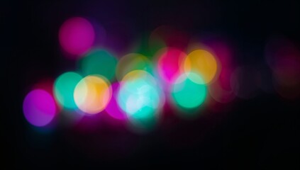 Vibrant abstract bokeh lights with soft blurred circles in pink, green, blue, and yellow tones on a dark background, creating a dreamy, modern, and artistic atmosphere.