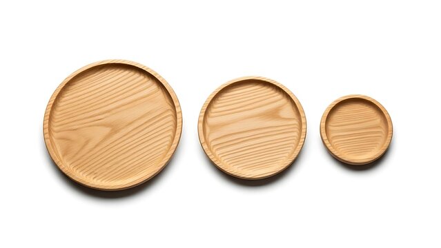 three wooden plates of different sizes made of light brown wood on white background