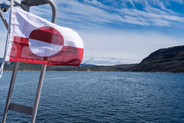 National Flag of Greenland on Boat in Disko Bay, Greenland © Michel