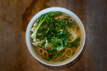 Vietnamese pho bo beef noodle soup served in bowl