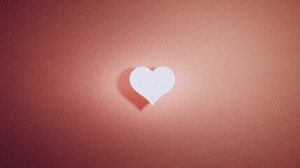 Paper heart creating shadow on pink background