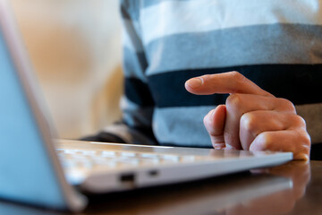 Hand Pointing Finger Over Laptop During Online Work, Gesture For Interface Navigation And Technology Control In Remote Office Browsing