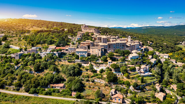 View of Simiane la Rotonde village in Provence, France. Lavender field and Simiane la rotonde village in Provence , France. Lavender field in front of Simiane La Rotonde, France.