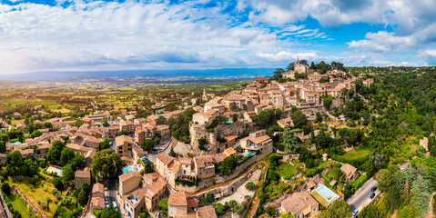 Village of Bonnieux showcasing architecture and serene landscapes, Provence, Luberon, France. Stunning views of Bonnieux medieval village surrounded by lush greenery and hills in Provence.