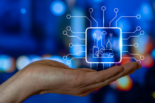 Hand Holding A Smart City Icon, Urban IoT Connectivity For Modern Digital Society, Internet Of Thing, Smart Infrastructure, Sustainable Living, Civilization Development and Progress - Powered by Adobe
