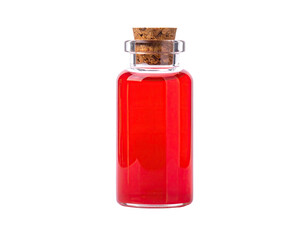 A small, transparent glass bottle filled with vibrant red liquid, sealed with a cork