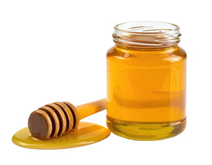 Close-up of a glass jar filled with golden liquid, honey dipper beside spill