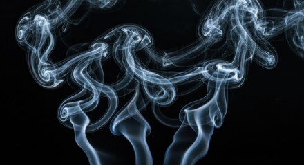 Wisps of white smoke swirling on a black background