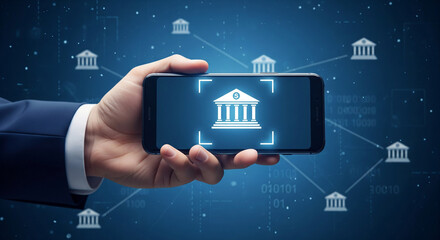 Hand holding smartphone displaying digital banking icon with network of financial institutions.