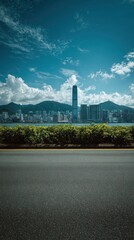 Hong kong cityscape with a clear blue sky and green foreground