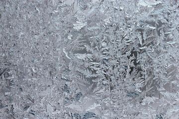 Obraz premium Beautiful frosty pattern on glass, background or texture 
