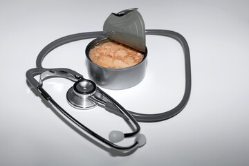 Heart health nutrition with tuna and stethoscope.