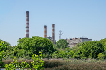 Obraz premium View of a factory from the Costanera Sur Reserve - Buenos Aires, Argentina