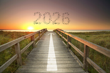 wooden pier with an arrow to the new year 2026