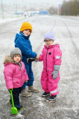 three siblings on winter day