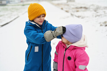 three siblings on winter day