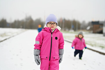 kid girl in warm jacket