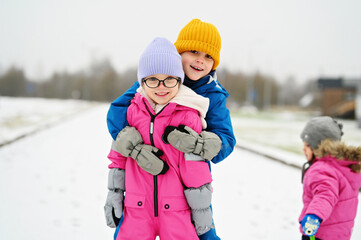 three siblings on winter day