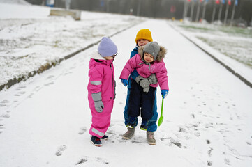 three siblings on winter day