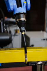 Robotic MIG MAG welding torch mounted on automation system for gas metal arc welding, feeding consumable wire and shielding gas to achieve stable welds in series production