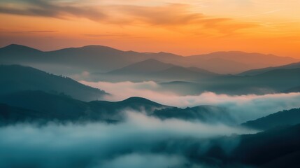 Obraz premium Misty Hills and Mountains at Sunrise with Soft Colorful Sky