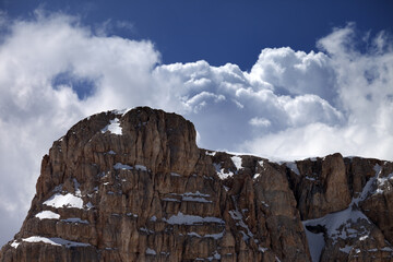 Top of mountain and blue sky with clouds
