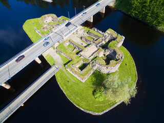 Aerial view of a ruined castle on an islet in the Kajaani River, Finland