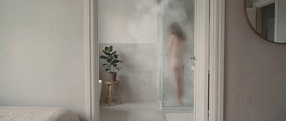 Abstract silhouette of woman showering behind frosted glass. Privacy, vulnerability and self care concept in modern home interior
