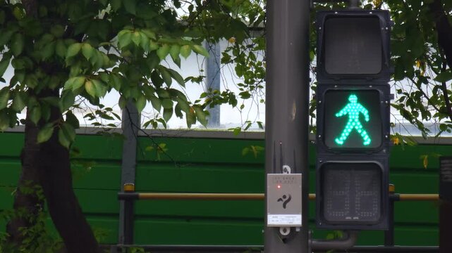 Pedestrian crossing lights in urban neighborhood with no walking red light illuminated.