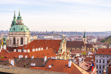 Fototapeta premium Praha tile roofs architecture in Prague Czech Republic Old church house building top view