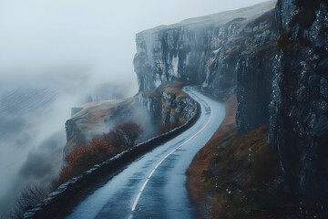 Mysterious mountain road winding through foggy cliffside for atmospheric travel scenes