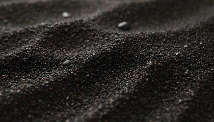Black Volcanic Sand Ripples Ground Texture Dark Mineral Surface pattern with small pebbles for geological beach and minimalist nature background