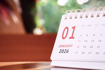 Calendar page of January 2026 on desk, with copy space. monthly planning concept, important schedules, meetings, and appointments.